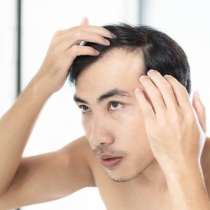 bigstock-Close-Up-Man-Looking-Reflectio-306374794