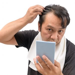 bigstock-Middle-aged-Asian-Man-Worry-Ab-311363395